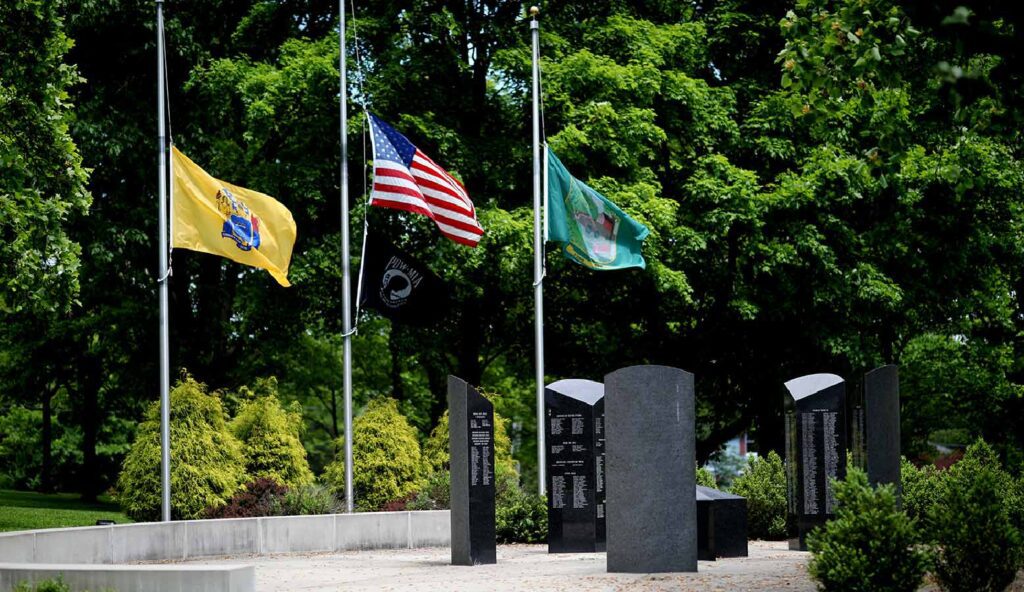 Memorial park with flags and granite monuments