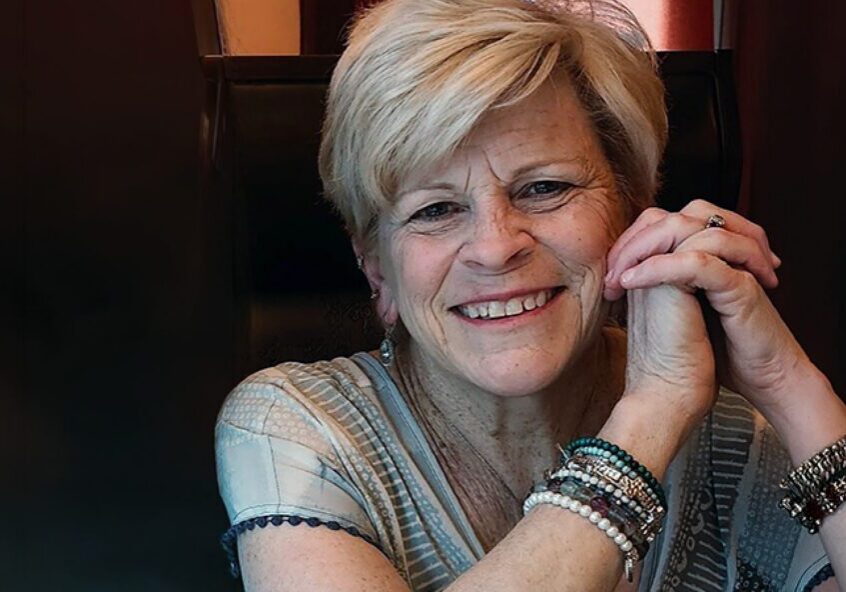 Smiling senior woman wearing bracelets