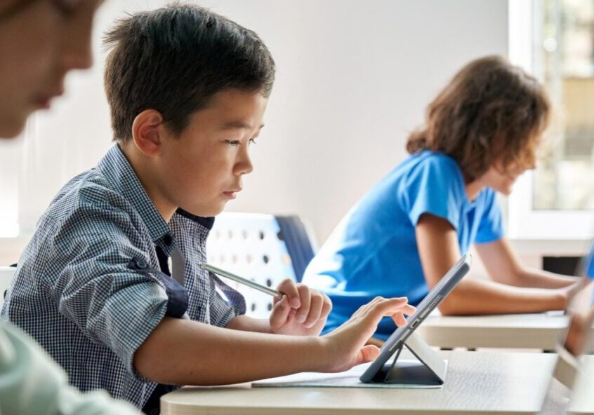 Students using tablets in classroom